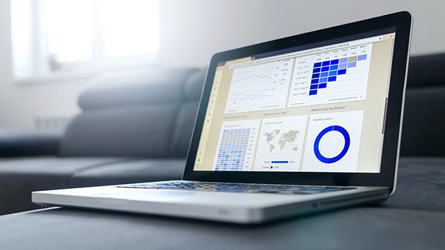 Spreadsheet financial data on laptop